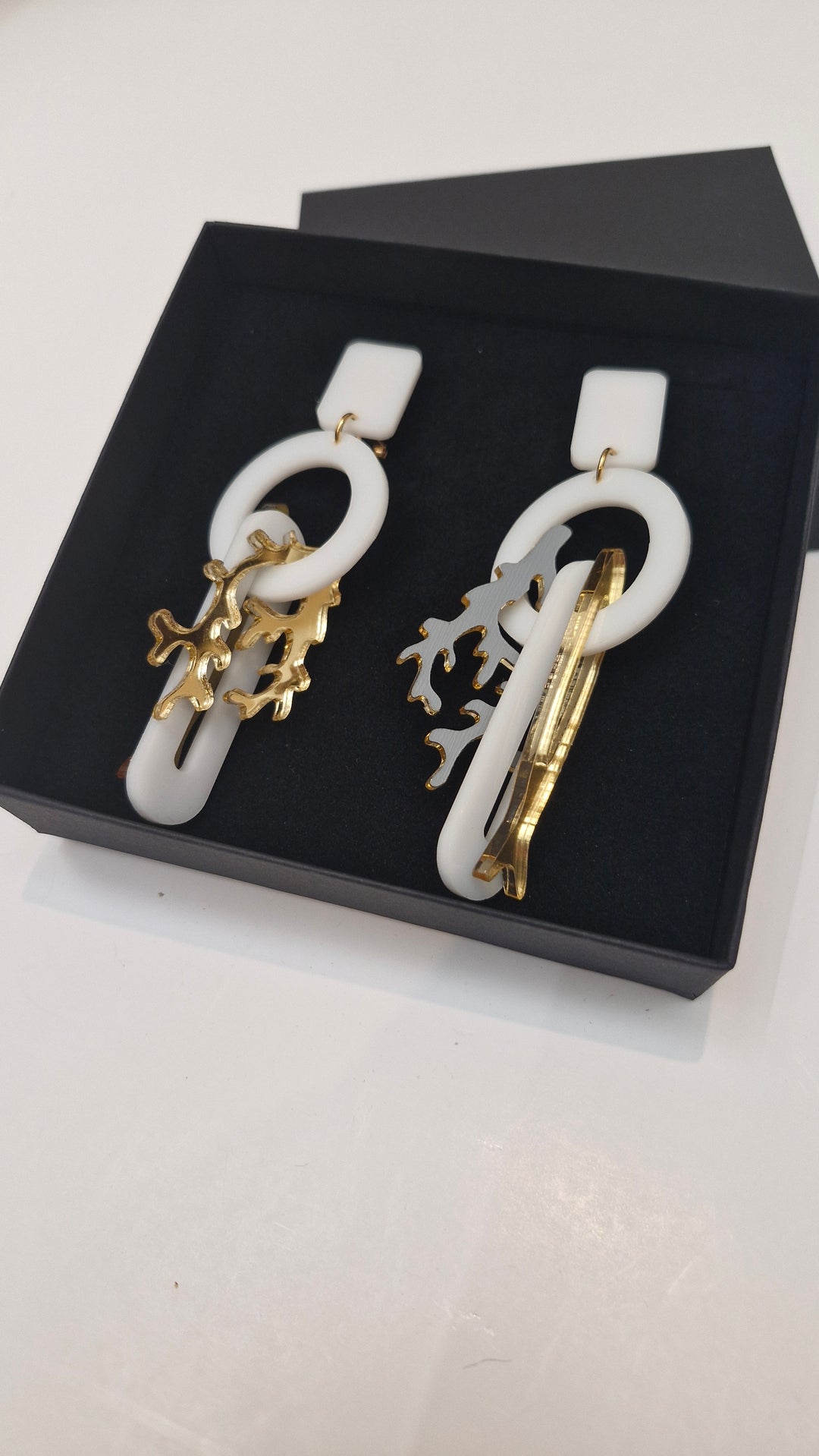White & gold Charm earrings